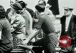 Image of French civilians listen to German propaganda broadcast Paris France, 1940, second 22 stock footage video 65675072694