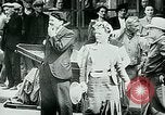 Image of French civilians listen to German propaganda broadcast Paris France, 1940, second 28 stock footage video 65675072694