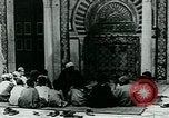 Image of Madrassa Islamic school outside a mosque Middle East, 1936, second 15 stock footage video 65675072701