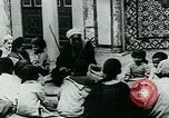 Image of Madrassa Islamic school outside a mosque Middle East, 1936, second 17 stock footage video 65675072701