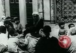 Image of Madrassa Islamic school outside a mosque Middle East, 1936, second 18 stock footage video 65675072701