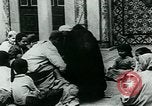 Image of Madrassa Islamic school outside a mosque Middle East, 1936, second 24 stock footage video 65675072701