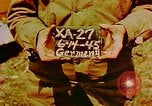 Image of German farmers work aroung a crashed U.S. Air Force P-47 in a field Germany, 1945, second 1 stock footage video 65675072706