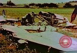 Image of German farmers work aroung a crashed U.S. Air Force P-47 in a field Germany, 1945, second 3 stock footage video 65675072706