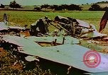 Image of German farmers work aroung a crashed U.S. Air Force P-47 in a field Germany, 1945, second 5 stock footage video 65675072706