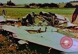 Image of German farmers work aroung a crashed U.S. Air Force P-47 in a field Germany, 1945, second 7 stock footage video 65675072706