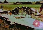 Image of German farmers work aroung a crashed U.S. Air Force P-47 in a field Germany, 1945, second 10 stock footage video 65675072706