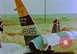 Image of German farmers work aroung a crashed U.S. Air Force P-47 in a field Germany, 1945, second 11 stock footage video 65675072706
