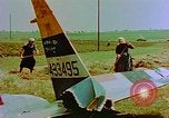 Image of German farmers work aroung a crashed U.S. Air Force P-47 in a field Germany, 1945, second 17 stock footage video 65675072706