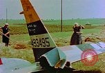 Image of German farmers work aroung a crashed U.S. Air Force P-47 in a field Germany, 1945, second 19 stock footage video 65675072706