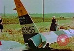 Image of German farmers work aroung a crashed U.S. Air Force P-47 in a field Germany, 1945, second 20 stock footage video 65675072706