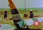 Image of German farmers work aroung a crashed U.S. Air Force P-47 in a field Germany, 1945, second 22 stock footage video 65675072706