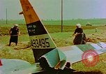 Image of German farmers work aroung a crashed U.S. Air Force P-47 in a field Germany, 1945, second 23 stock footage video 65675072706