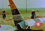 Image of German farmers work aroung a crashed U.S. Air Force P-47 in a field Germany, 1945, second 24 stock footage video 65675072706