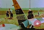 Image of German farmers work aroung a crashed U.S. Air Force P-47 in a field Germany, 1945, second 25 stock footage video 65675072706