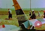 Image of German farmers work aroung a crashed U.S. Air Force P-47 in a field Germany, 1945, second 28 stock footage video 65675072706