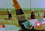 Image of German farmers work aroung a crashed U.S. Air Force P-47 in a field Germany, 1945, second 29 stock footage video 65675072706