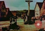 Image of German farmers work aroung a crashed U.S. Air Force P-47 in a field Germany, 1945, second 34 stock footage video 65675072706