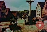 Image of German farmers work aroung a crashed U.S. Air Force P-47 in a field Germany, 1945, second 35 stock footage video 65675072706