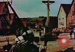 Image of German farmers work aroung a crashed U.S. Air Force P-47 in a field Germany, 1945, second 36 stock footage video 65675072706