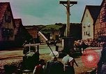 Image of German farmers work aroung a crashed U.S. Air Force P-47 in a field Germany, 1945, second 38 stock footage video 65675072706