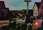 Image of German farmers work aroung a crashed U.S. Air Force P-47 in a field Germany, 1945, second 39 stock footage video 65675072706