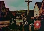 Image of German farmers work aroung a crashed U.S. Air Force P-47 in a field Germany, 1945, second 40 stock footage video 65675072706