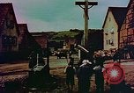 Image of German farmers work aroung a crashed U.S. Air Force P-47 in a field Germany, 1945, second 41 stock footage video 65675072706