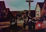 Image of German farmers work aroung a crashed U.S. Air Force P-47 in a field Germany, 1945, second 42 stock footage video 65675072706