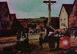 Image of German farmers work aroung a crashed U.S. Air Force P-47 in a field Germany, 1945, second 43 stock footage video 65675072706