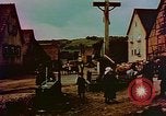 Image of German farmers work aroung a crashed U.S. Air Force P-47 in a field Germany, 1945, second 44 stock footage video 65675072706