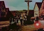 Image of German farmers work aroung a crashed U.S. Air Force P-47 in a field Germany, 1945, second 47 stock footage video 65675072706
