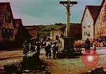 Image of German farmers work aroung a crashed U.S. Air Force P-47 in a field Germany, 1945, second 48 stock footage video 65675072706