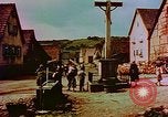 Image of German farmers work aroung a crashed U.S. Air Force P-47 in a field Germany, 1945, second 49 stock footage video 65675072706