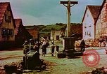 Image of German farmers work aroung a crashed U.S. Air Force P-47 in a field Germany, 1945, second 50 stock footage video 65675072706