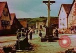 Image of German farmers work aroung a crashed U.S. Air Force P-47 in a field Germany, 1945, second 51 stock footage video 65675072706