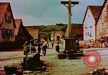 Image of German farmers work aroung a crashed U.S. Air Force P-47 in a field Germany, 1945, second 52 stock footage video 65675072706