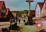 Image of German farmers work aroung a crashed U.S. Air Force P-47 in a field Germany, 1945, second 53 stock footage video 65675072706