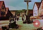Image of German farmers work aroung a crashed U.S. Air Force P-47 in a field Germany, 1945, second 55 stock footage video 65675072706