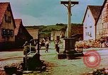 Image of German farmers work aroung a crashed U.S. Air Force P-47 in a field Germany, 1945, second 56 stock footage video 65675072706