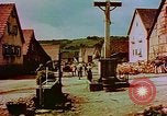 Image of German farmers work aroung a crashed U.S. Air Force P-47 in a field Germany, 1945, second 57 stock footage video 65675072706