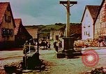 Image of German farmers work aroung a crashed U.S. Air Force P-47 in a field Germany, 1945, second 59 stock footage video 65675072706