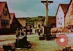 Image of German farmers work aroung a crashed U.S. Air Force P-47 in a field Germany, 1945, second 60 stock footage video 65675072706