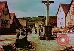 Image of German farmers work aroung a crashed U.S. Air Force P-47 in a field Germany, 1945, second 62 stock footage video 65675072706