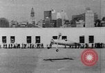 Image of Autogyro delivers mail to top of Post Office building United States USA, 1935, second 14 stock footage video 65675072921