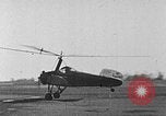 Image of Autogiro lands and takes off at a seaport United States USA, 1934, second 3 stock footage video 65675072923