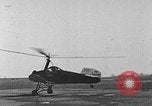 Image of Autogiro lands and takes off at a seaport United States USA, 1934, second 4 stock footage video 65675072923