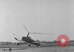 Image of Autogiro lands and takes off at a seaport United States USA, 1934, second 6 stock footage video 65675072923