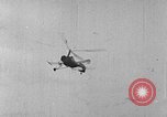 Image of Autogiro lands and takes off at a seaport United States USA, 1934, second 9 stock footage video 65675072923
