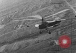 Image of Autogiro lands and takes off at a seaport United States USA, 1934, second 10 stock footage video 65675072923